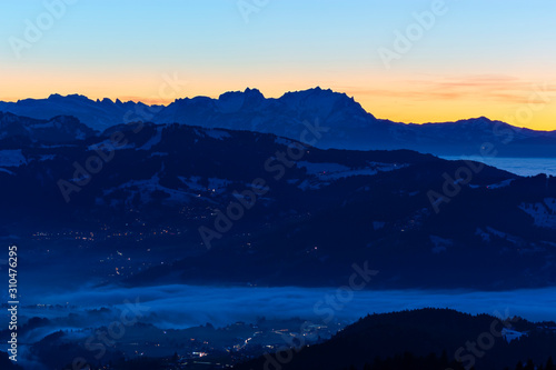 Saentis mountain at sunset. Alpine landscape with colorful sky. Austria, Switzerland