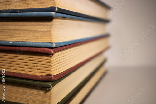 stack of books on white background close up