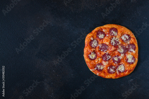 salami pizza with cheese (dough, tomato sauce and other ingredients) menu concept. food background. top view. copy space