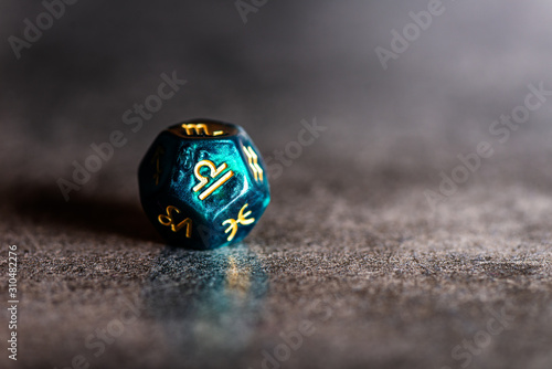 Astrology Dice with zodiac symbol of Libra Sep 23 - Oct 22 on dark background photo