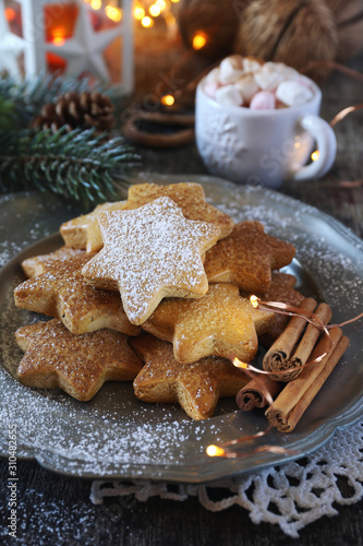 Christmas cinnamon cookies (spice-cake),  cup of coffee with marshmallows and New Year's decoration