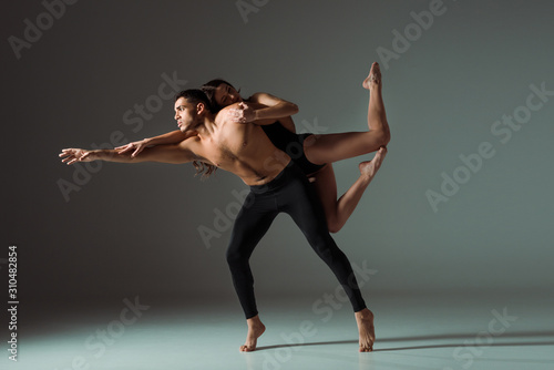 Wallpaper Mural sexy dancers dancing contemporary on dark background with copy space Torontodigital.ca