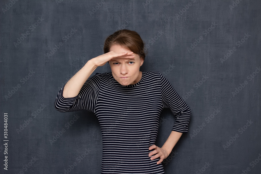 Portrait of angry dissatisfied young woman looking far away Portrait of angry dissatisfied young woman looking far away