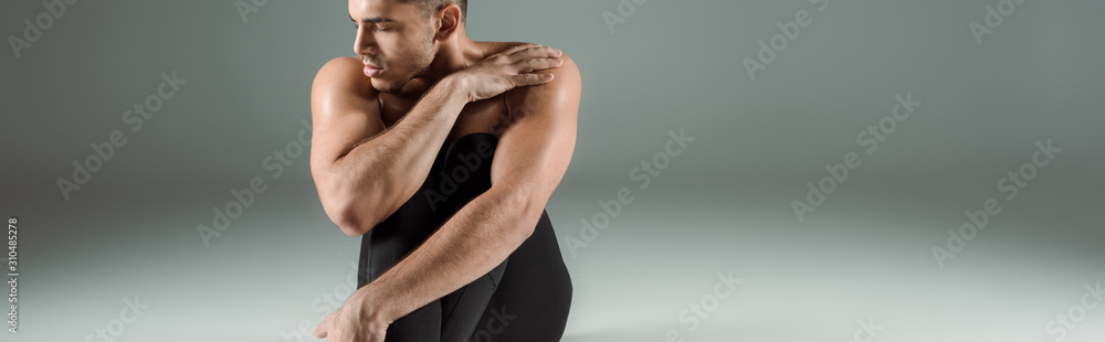 panoramic shot of handsome dancer in black leggings dancing contemporary on dark background panoramic shot of handsome dancer in black leggings dancing contemporary on dark background