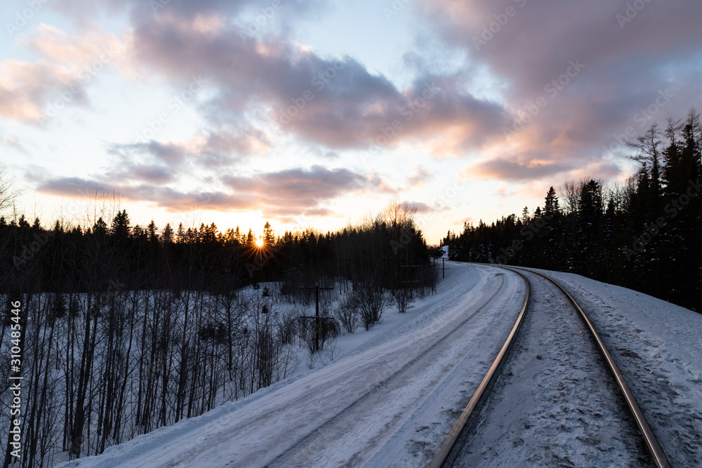 Sunset over winter train tracks Sunset over winter train tracks