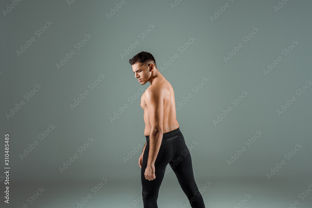 handsome dancer in black leggings dancing contemporary on grey background handsome dancer in black leggings dancing contemporary on grey background