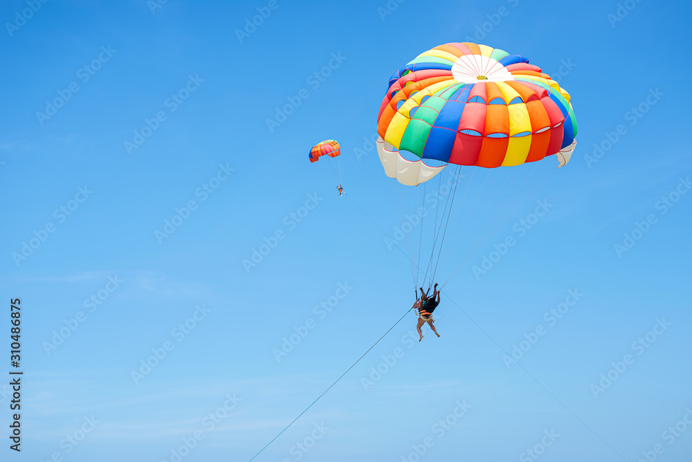 Colorful of the parachute floating in the sky Colorful of the parachute floating in the sky