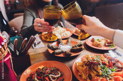 Obraz na plátně View from above of georgian cuisine on brown wooden table