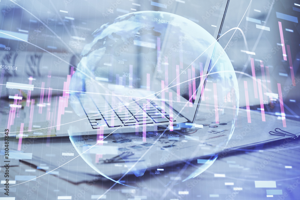 Stock market chart hologram drawn on personal computer background. Multi exposure. Concept of investment. Stock market chart hologram drawn on personal computer background. Multi exposure. Concept of investment.