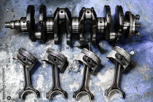 Bild auf Leinwand crankshaft and pistons with connecting rods on the table