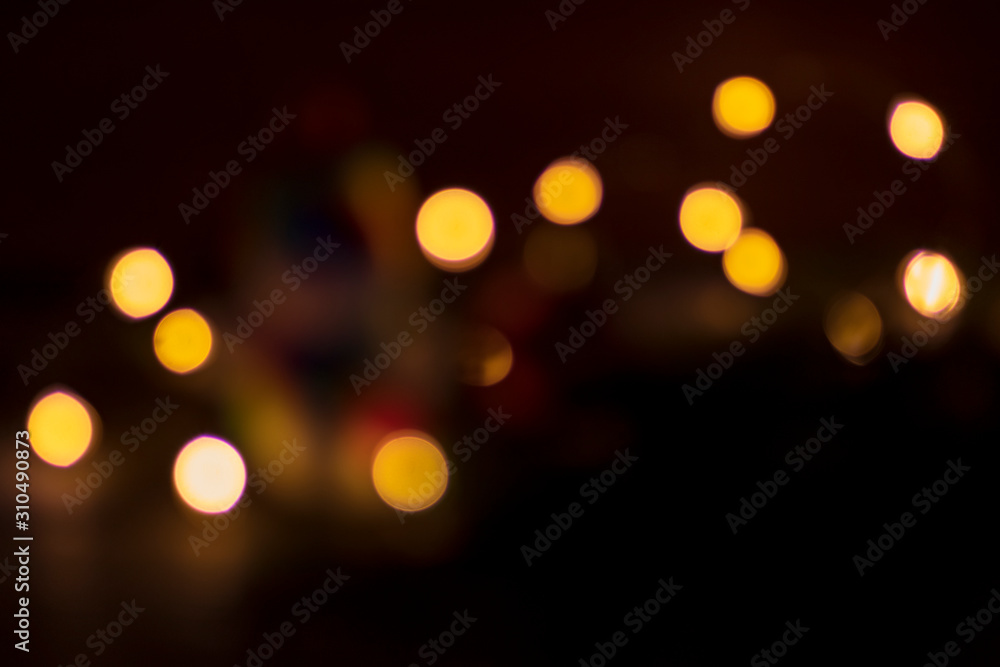 Obraz premium no focus, black background. lights, garland. single color.