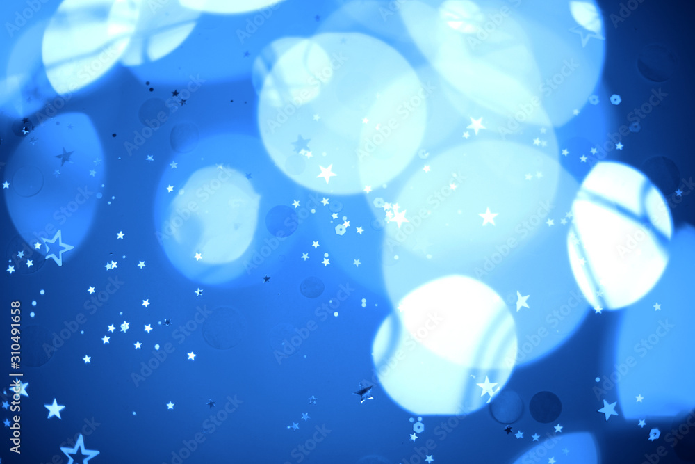 Blurred blue festive lights. Christmas time concept. Perfect new year backdrop. Party concept. Blurred blue festive lights. Christmas time concept. Perfect new year backdrop. Party concept.