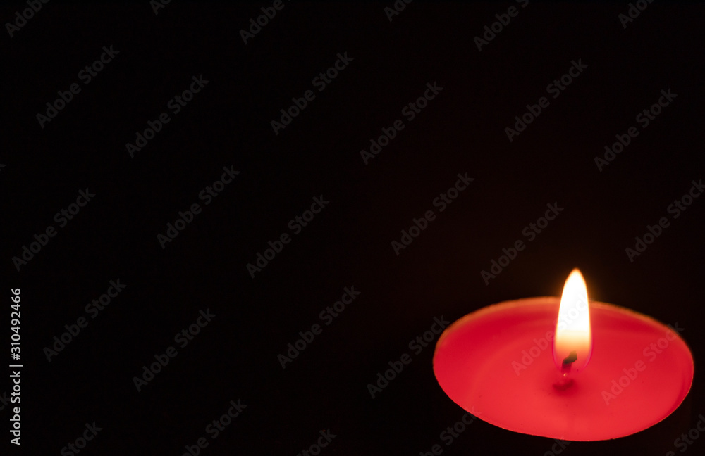 Red candles on a black background. Fire in the dark. Candle light. Light it up. Forever. Red candles on a black background. Fire in the dark. Candle light. Light it up. Forever.