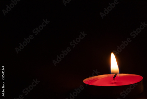 Red candles on a black background. Fire in the dark. Candle light. Light it up. Forever.