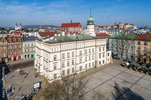 Old town hall of Kazimierz town, then the Jewish district of Krakow, Poland, situated at Wolnica Square. Wawel Castle, St Catherine church, Skalka church and monastery in the background. Aerial view photo