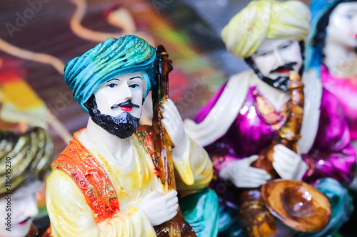 Selective Focus on Statue Of Indian Traditional Cultural Men In Turban Playing Musical Instrument