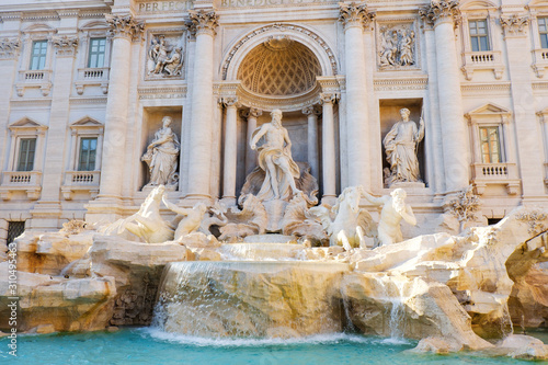 Trevi Fountain in Rome, beautiful rococo fountain with sculpted figures. Fontana di Trevi in Roma, Italy, Europe. Famous travel destination. Italian roman architecture and landmark in eternal city.