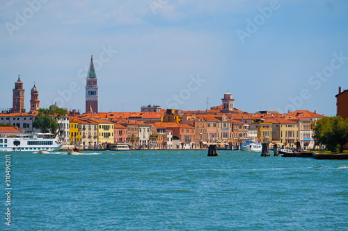 Beautiful view of Venice  Italy with Campanile tower of Saint Mark s Cathedral  Basilica on San Marco square and Doges  Palace. Italian buildings cityscape. Famous romantic city on water.