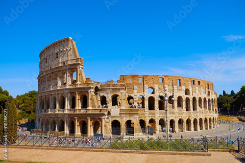 Coliseum Flavian amphitheater (Anfiteatro Flavio, Colosseo) in Rome, Italy. Colosseum forum view, famous tourist landmark. Antique roman gladiator arena.