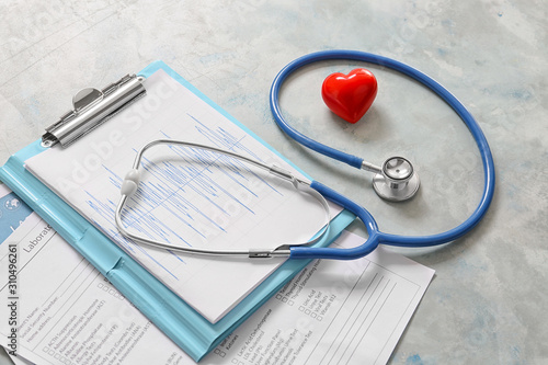 Stethoscope, heart and docu...