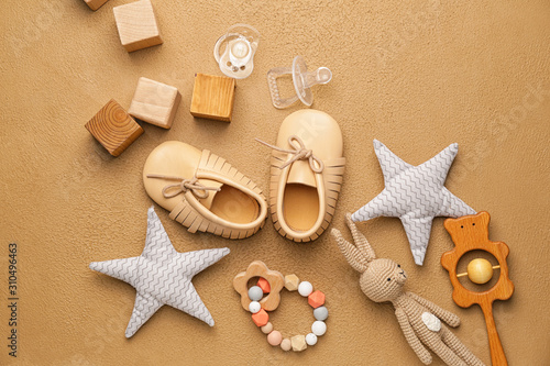Baby booties with toys on c...