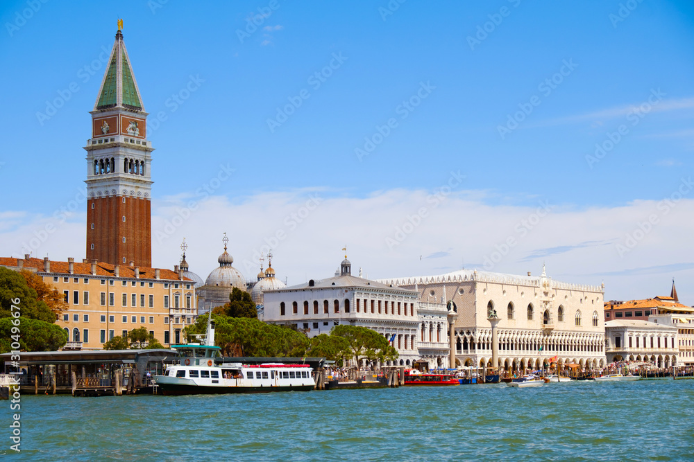 Beautiful view of Venice, Italy with Campanile tower of Saint Mark's Cathedral, Basilica on San Marco square and Doges' Palace. Italian buildings cityscape. Famous romantic city on water. 