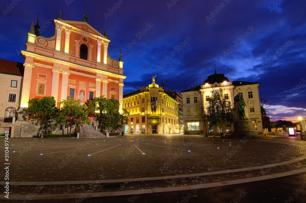 Ljubljana, Slovenia-September 30, 2019: Panoramic landscape view of Preseren Square. Illuminated medieval buildings. It is the central square in Ljubljana. Early morning, few minutes before sunrise