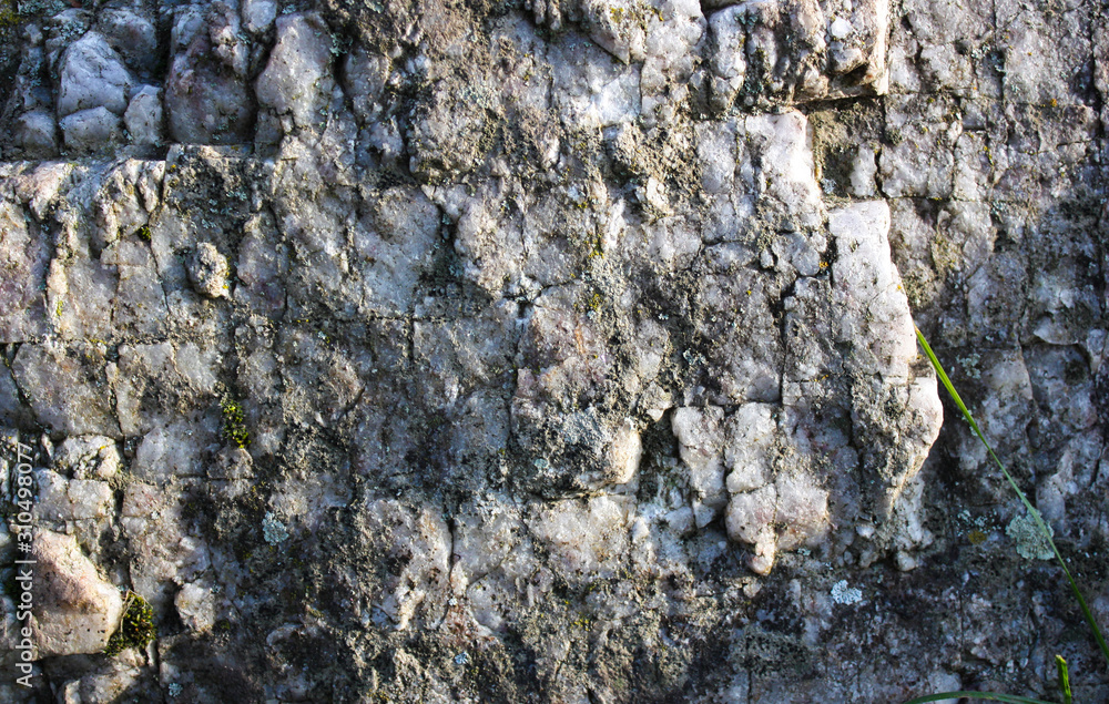 Old solid stone wall. Close up.