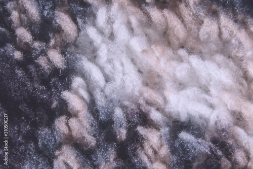 Abstract fleece background, fleece wilds. Fleece is a synthetic knitted fabric made of polyester for the manufacture of warm clothing close-up. © Mikhail