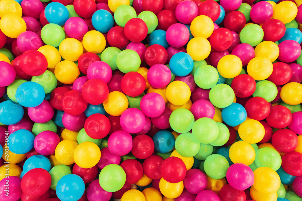 texture on the wallpaper a lot of colorful balls in a heap, a children's pool for games of preschool age, bright colors, spherical shape, cause emotion joy, background, material plastic. texture on the wallpaper a lot of colorful balls in a heap, a children's pool for games of preschool age, bright colors, spherical shape, cause emotion joy, background, material plastic.
