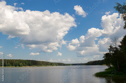Cumulonimbus clouds over lake, abstract nature background