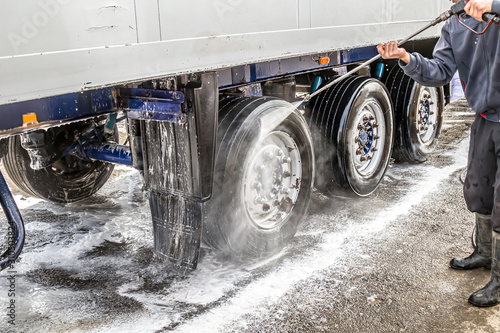 Washing a truck outdoors. Close-up. Car wash with detergents. photo