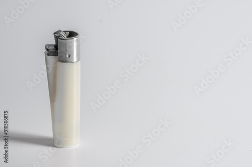 one White lighter isolated on White background with space for text