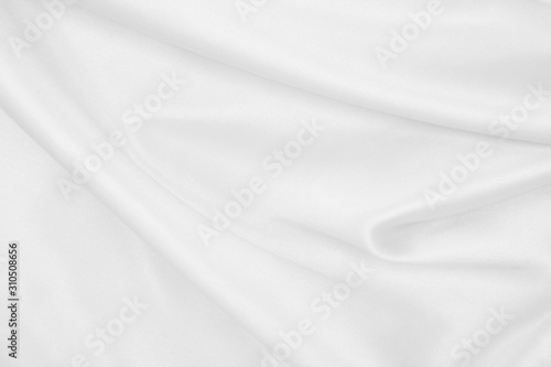 Smooth elegant white silk or satin luxury cloth texture as wedding background. Luxurious background design