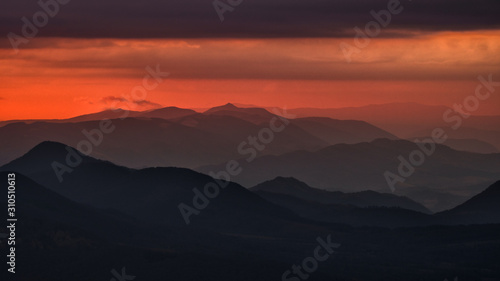 Splendid mountain sunrise. Mountains silhouettes on a beauty background. Bieszczady Mountains Poland. © Szymon Bartosz