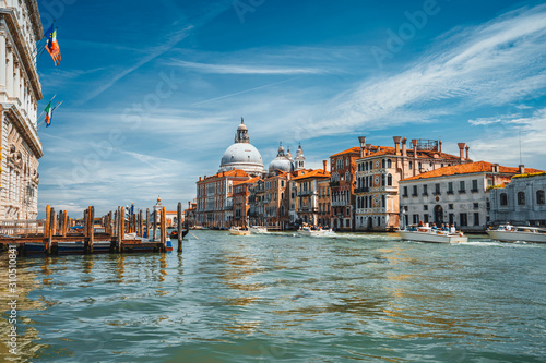 Pleasure tourist boats on Grand Canal and Basilica Santa Maria della Salute, Venice, Italy © Igor Tichonow