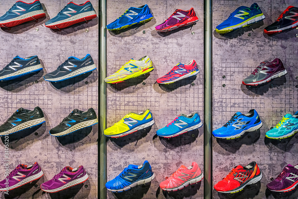 MADRID, SPAIN - SEPTEMBER 9: New Balance athletic shoes on a sports shop  counter in Madrid on September 9 2015. New Balance - American manufacturer  of sportswear Stock Photo | Adobe Stock