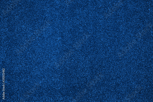 Festive abstract blue glitter background. Colour of year classic blue.