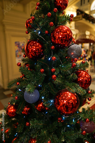 Christmas decorations on the Christmas tree. Red ball.