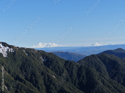 Mountain view, with 2 volcano covered in snow in the background in new zealand