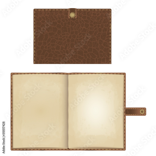 notebook in brown leather stitched cover with a strap on the clasp. closed and open version with yellowed paper pages.