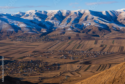 Breathtaking snowy mountain landscape with settlements, Armenia
