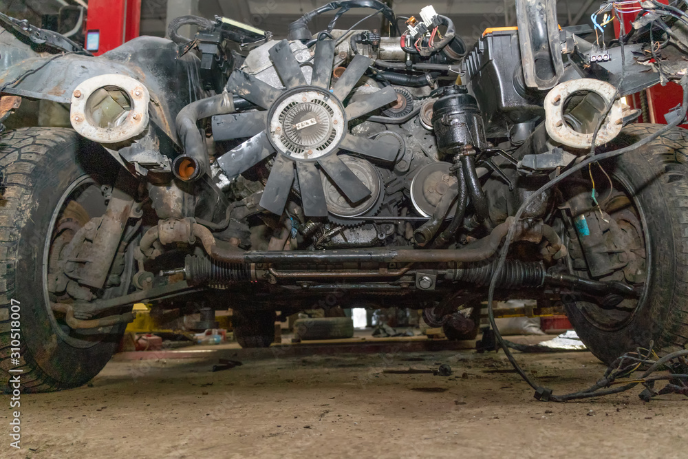 Fototapeta premium Semi-disassembled car after an accident close-up on the auto Assembly. Concept of car service, auto Assembly, used auto parts