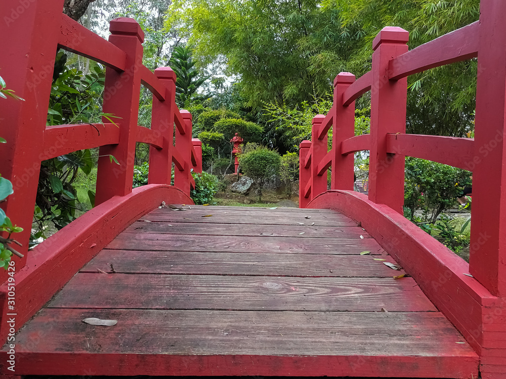 Japanese garden with red arch bridge. Japanese garden with red arch bridge.