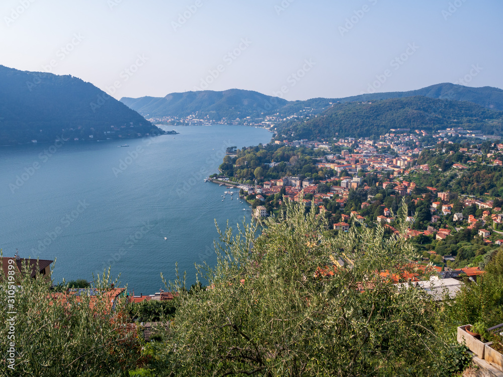 View from the hill of Cernobbio on the city and the lake of Como, a sunny morning