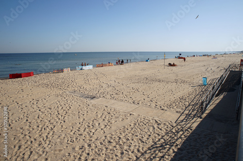 beach with chairs and umbrellas on beach