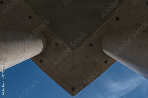 Bottom view of the powerful columns on which stands a modern skyscraper