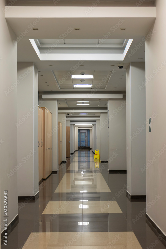 Empty long office corridor