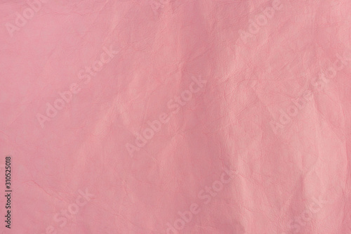  pink crumpled leather background close-up