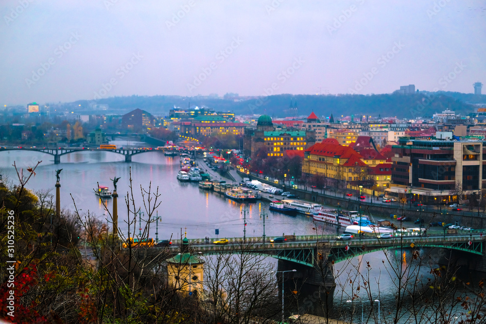 landscape image of the center of Prague with the Vltava river at evening